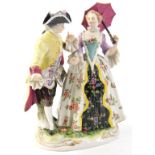 A German porcelain figure group, depicting a lady with a pink and floral parasol beside a