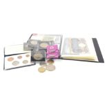 A collection of coins and bank notes, to include green pound notes, blue examples, foreign bank