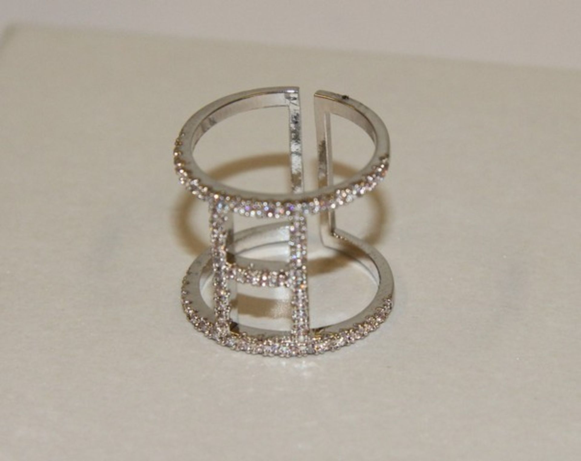 V Brand New Platinum Plated White Stone Buckle Style Ring