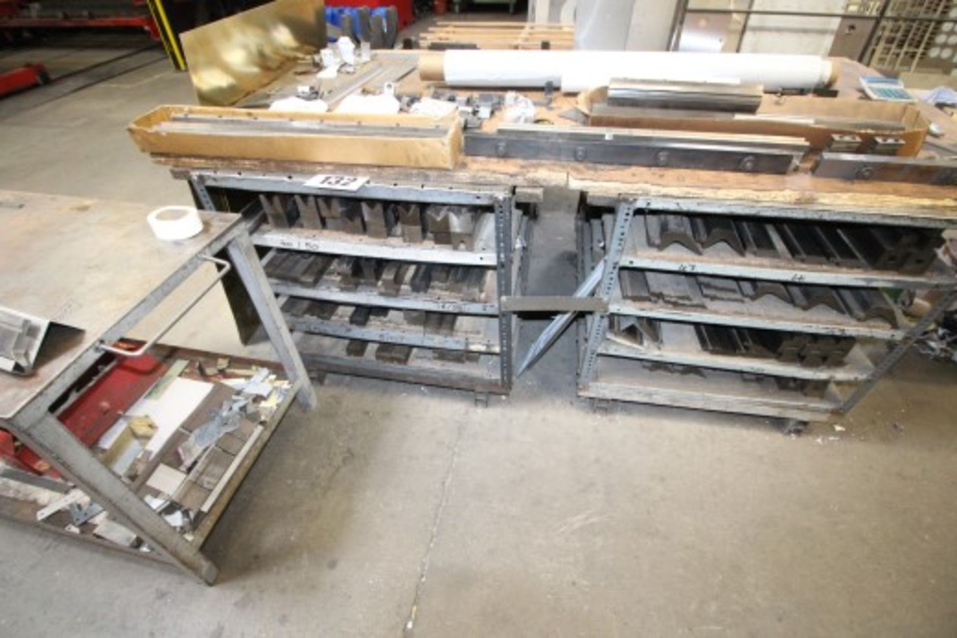 2 METAL BENCHES WITH SHELVES UNDER & CONTENTS OF PRESS BRAKE TOOLING & SEPARATE MOBILE TROLLEY 36" x