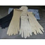 Four pairs of Ladies Vintage gloves. Two cream/white, one pair Dark blue and also a pair of Beaded