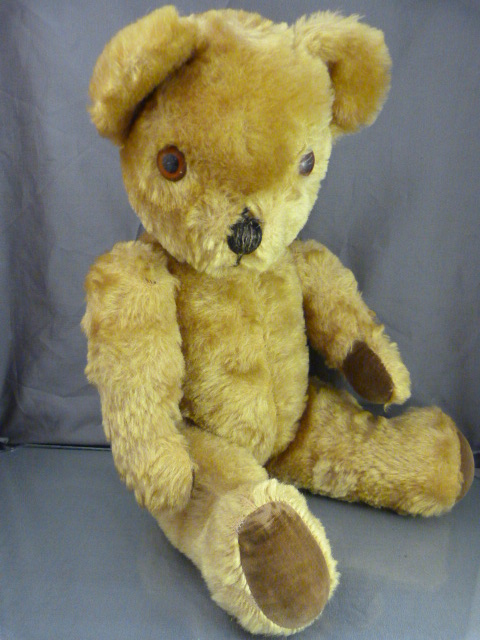 Antique Mohair teddy bear with growler and plastic eyes.