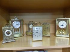 Collection of mainly brass cased clocks
