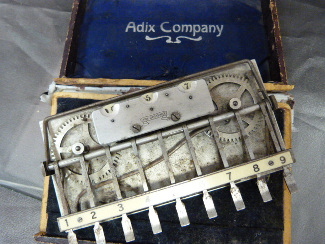 An Adix company (Germany) pocket adding machine with ivorine board contained with in original - Image 3 of 3