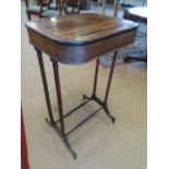 Victorian Rosewood works table on tall Spindle turned legs with two stretchers. Gilded twisted