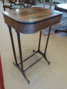 Victorian Rosewood works table on tall Spindle turned legs with two stretchers. Gilded twisted