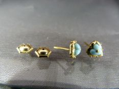 Gold Coloured earrings set with a turquoise hearts. no Gold marks.