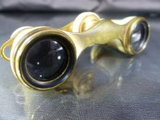 Edwardian pair of bone/ivory opera glasses with gilt brass fittings