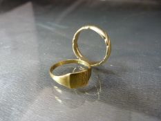 2 x 9ct Gold Ladies signet ring along with another 'twisted' rope style ring. Both hallmarked 9ct.