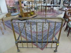 Early single brass bed frame by Heals.