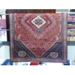 Large red ground rug of possible Turkish origin.