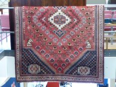 Large red ground rug of possible Turkish origin.