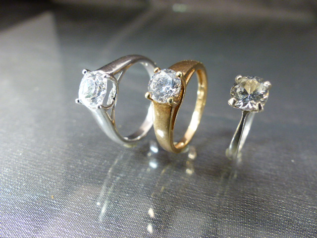 Three CZ solitaire rings - (1) approx 1ct (Diamond Size) CZ gold on silver UK - P, USA - 7.5. (2)