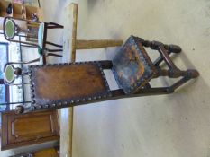 Tall antique Gothic Childrens Punishment chair with studded leather seat and back in the spanish