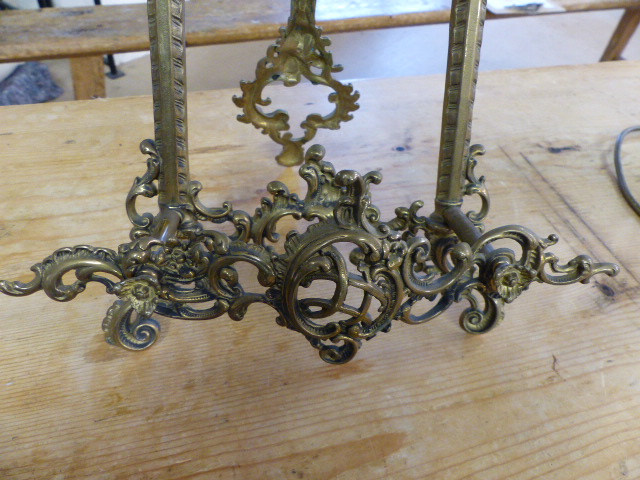 Unusual brass bookstand decorated with scrolls and flowers along with two similar door plates - Image 2 of 6