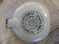 The Adaptable Hot Water bottle by Old Fulham Pottery with cast metal handle.