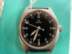 Omega Military style wrist watch with Luminescent hour marks. Nickel cased with markings to back W.