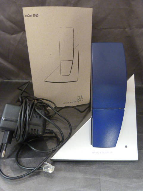 A Bang and Olufsen cordless phone of Geometric form. With original manual.