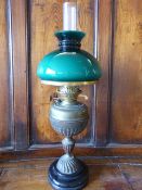 Unusual oil lamp with Twin Duplex burner on a Trophy style brass column with black circular