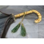 Good Quality early Edwardian umbrella with bamboo handle with tassle. Black fabric mounted onto a