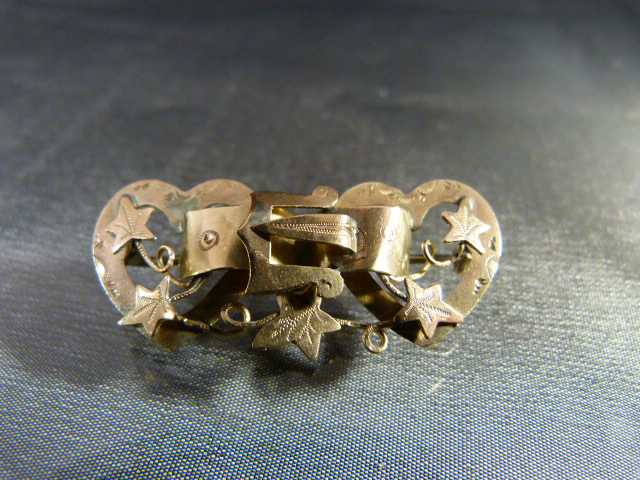 9ct Rose Gold Victorian Brooch formed of a Central Buckle linking two hearts and with stylised Ivy