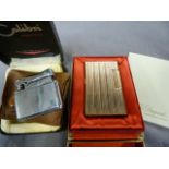 Dupont Gold plated gas lighter in original casing with paperwork and a Calibri lighter in leather