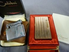 Dupont Gold plated gas lighter in original casing with paperwork and a Calibri lighter in leather