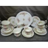 Royal Albert Tea service 'Moss Rose' pattern. Missing teapot and sugar bowl, one spare saucer.
