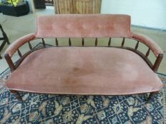 Pink upholstered victorian settee on Mahogany frame