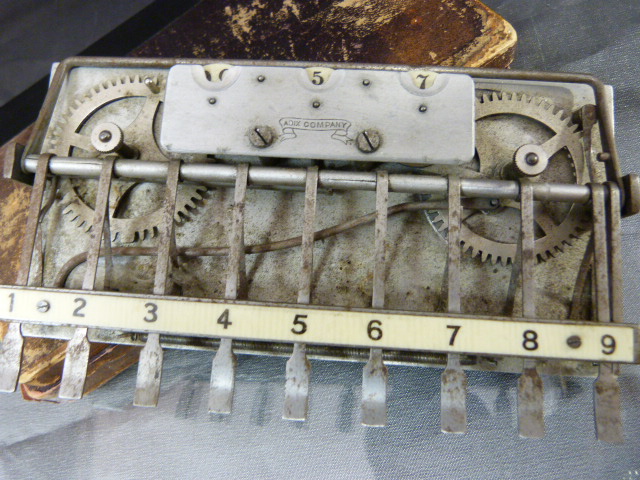 An Adix company (Germany) pocket adding machine with ivorine board contained with in original - Image 2 of 3