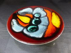 Poole Pottery shape 49 Delphis pin dish decorated with an abstract motif in tones of blue green, red