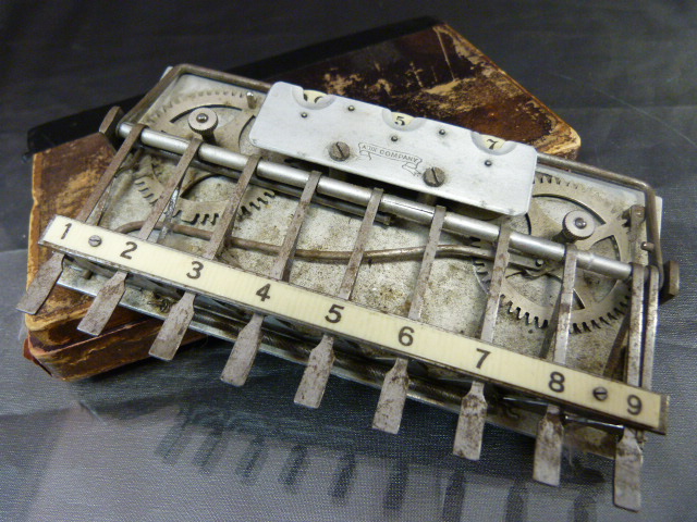 An Adix company (Germany) pocket adding machine with ivorine board contained with in original