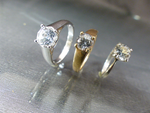 Three CZ solitaire rings - (1) approx 1ct (Diamond Size) CZ gold on silver UK - P, USA - 7.5. (2) - Image 2 of 5