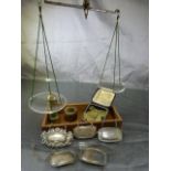 Pair of scales with glass bowls and metal weights along with selection of bottle labels