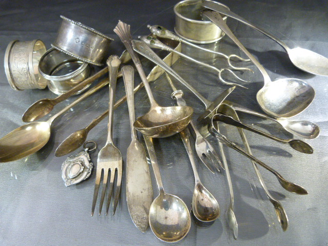 Collection of hallmarked silver items to include various spoons, napkin rings etc. Total weight