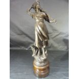 French Bronzed figure of a lady fishing with her catch in a basket. Height - 37cm approx
