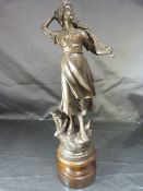 French Bronzed figure of a lady fishing with her catch in a basket. Height - 37cm approx