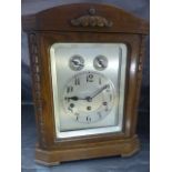 Jughans Wurttemberg German Mantle clock of Architectural Form. The oak finished mantle clock has