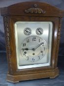 Jughans Wurttemberg German Mantle clock of Architectural Form. The oak finished mantle clock has