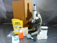 Opax school microscope in case with accessories to include an NCR Microform of the Bible