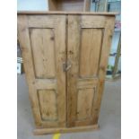 Halfsize deep set antique pine two door cupboard with shelves in.