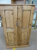 Halfsize deep set antique pine two door cupboard with shelves in.