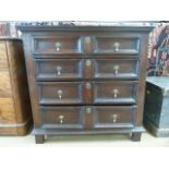 Oak chest with four illusion drawers with bell handles.