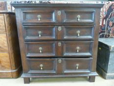 Oak chest with four illusion drawers with bell handles.