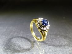 A Steel and Dolphin 70's poss 9ct (hallmark rubbed) Sapphire and Diamond flower design ring.