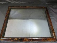 An Early Tortoise shell on wood wall mirror. The Rectangular frame houses a relatively chunky