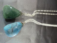 Large rough cut polished turquoise pendant on a Silver Belcher chain along with another green
