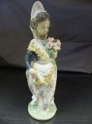Lladro figure of an Oriental girl holding a spray of flowers. 1 Flower head has been replaced
