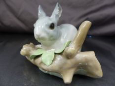 Lladro figure of a rabbit on a branch