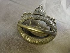 A WW1 German U-Boat badge marked Walter Schot on the reverse